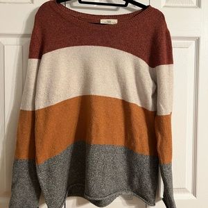 Large, burnt orange crew neck sweater